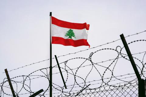 Lebanon flag in barbed wire, sanctions and aggression of Lebanon