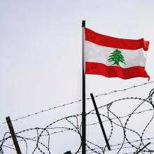 Lebanon flag in barbed wire, sanctions and aggression of Lebanon